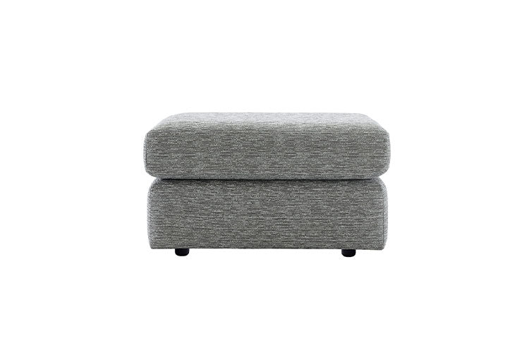 Gray upholstered ottoman on a white background