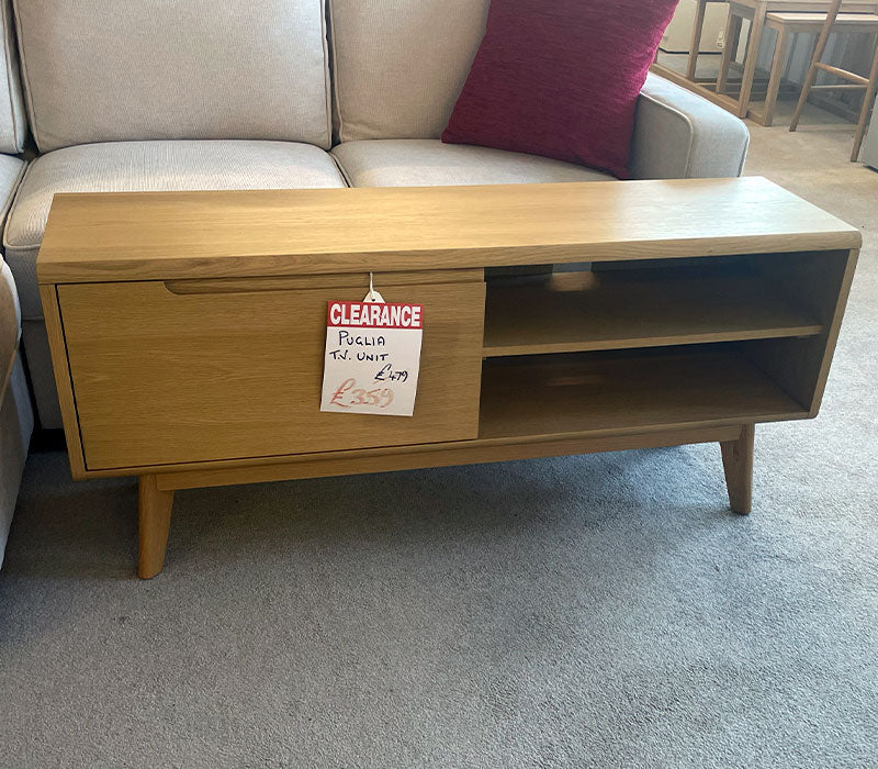 Wooden TV unit on a shop floor