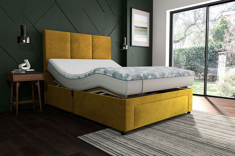 Yellow bed frame with mattress in a room with a window and decor.