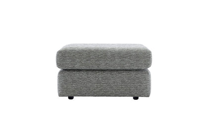 Gray upholstered ottoman on a white background