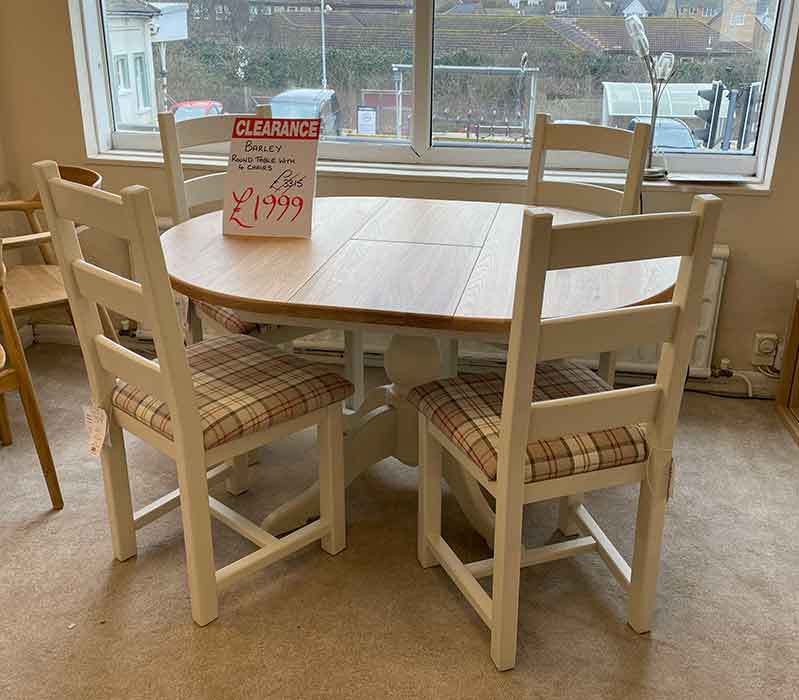 Round wooden table with 4 chairs